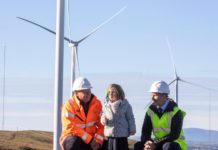 Co-owned by locals, Britain’s biggest subsidy-free onshore wind farm is opened