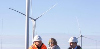 Co-owned by locals, Britain’s biggest subsidy-free onshore wind farm is opened