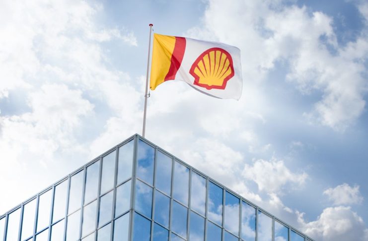 Shell bows to court pressure, pledges to halve own emissions by 2030