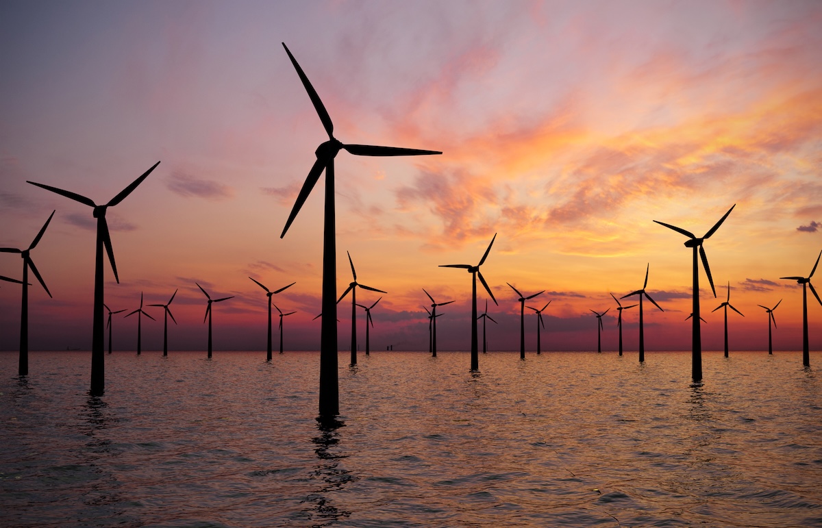 Offshore,Wind,Turbines,Farm,At,Sunset
