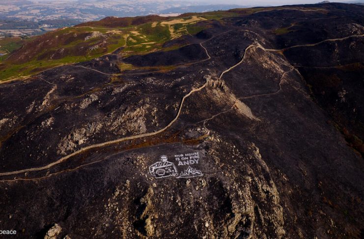 Activists paint giant climate warning to Burnham on mountainside scorched by wildfiresÂ