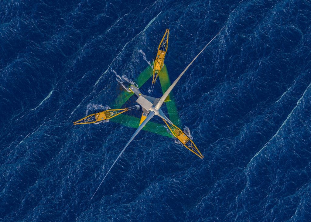 Gazelle Wind Power floating offshore wind platform at sea, yellow articulated frame structure with wind turbine, mild sea conditions.