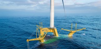 Gazelle Wind Power develops breakthrough floating platform design for 18MW+ wind turbines in extreme conditions Gazelle Wind Power floating offshore wind platform at sea, yellow articulated frame structure with wind turbine, mild sea conditions.